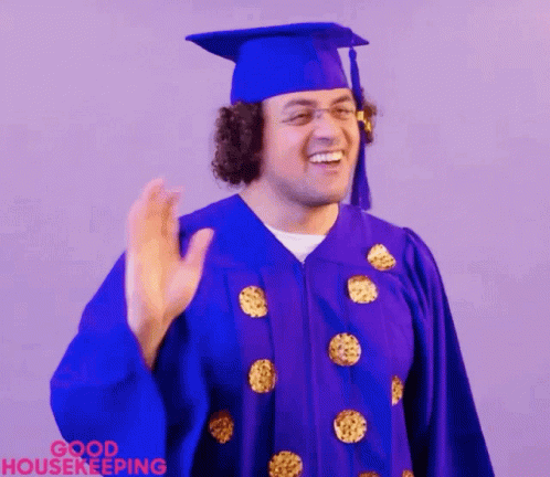 Man in Purple Graduation Cap and Gown Waving