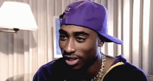 Man in Purple Hat and Gold Chain