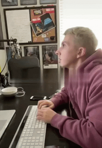 Man In Purple Hoodie Typing GIF