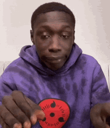 Man in Purple Hoodie With Red Eye