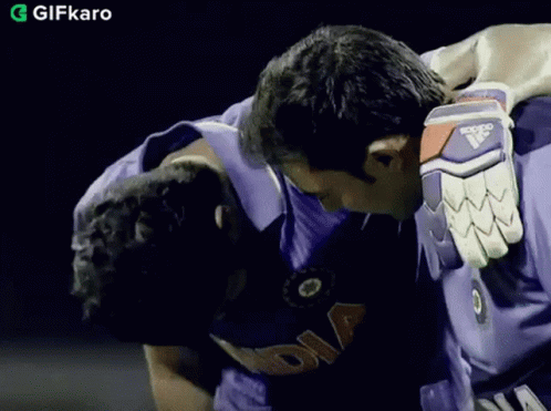 Man in Purple India Shirt Hugging