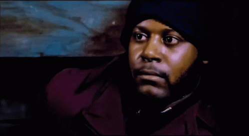 Man In Purple Jacket And Blue Hat Close Up GIF