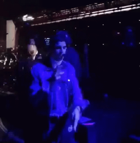 Man in Purple Jacket Dancing