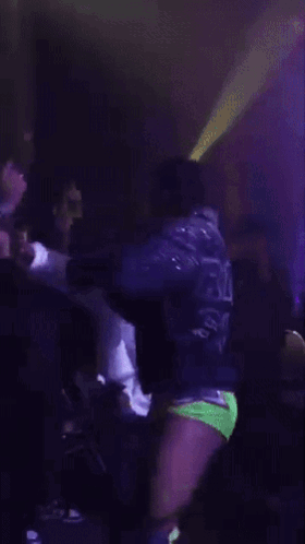 Man in Purple Jacket With Word Ricky