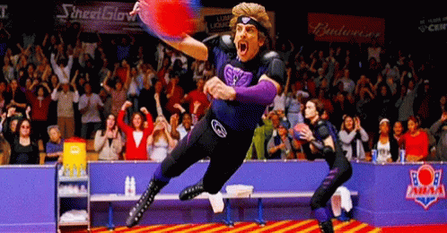 Man in Purple Jersey Jumping with Budweiser Banner