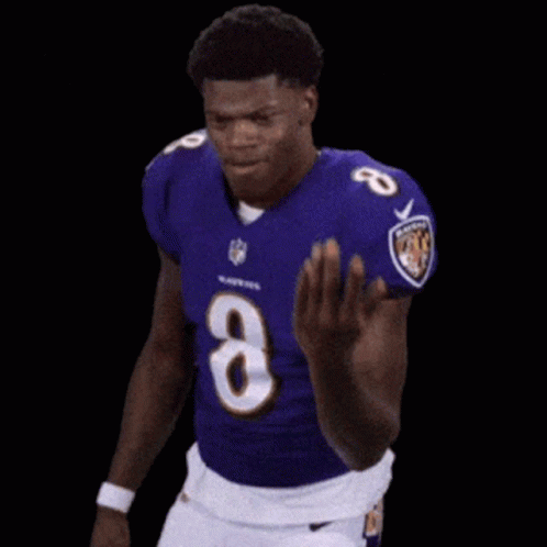 Man in Purple Jersey Number 8 Running