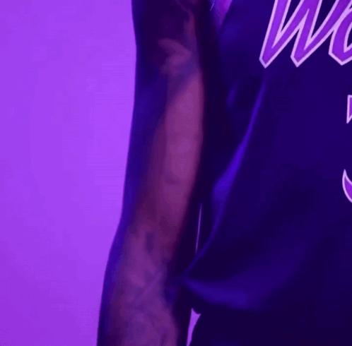 Man in Purple Jersey Saying Wolves