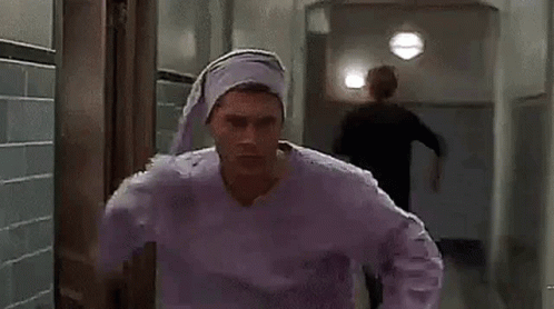 Man In Purple Pajama Top And Purple Hat GIF