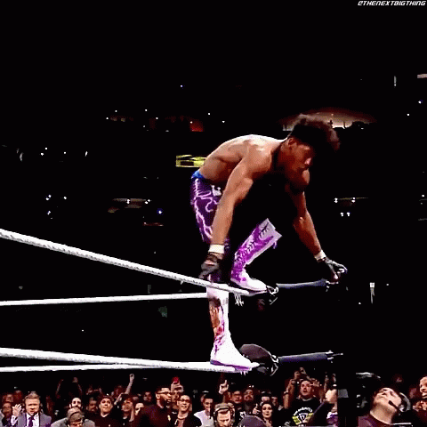 Man in Purple Pants Kicking Opponent