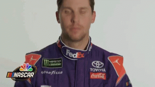 Man In Purple Racing Suit With Logos GIF