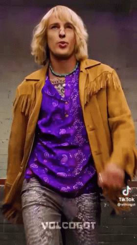 Man in Purple Shirt and Brown Jacket Dancing