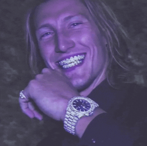 Man in Purple Shirt and White Watch Smiling