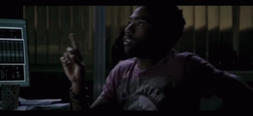 Man In Purple Shirt At Computer GIF