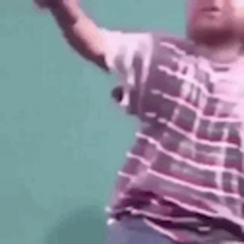 Man in Purple Shirt Dancing Arms Outstretched