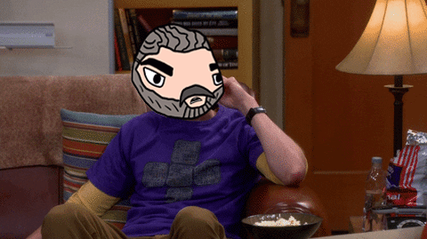 Man in Purple Shirt Eating Popcorn on Couch