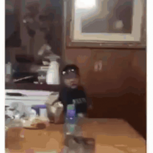 Man In Purple Shirt Hands On Hips Kitchen GIF