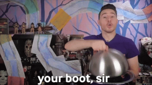 Man In Purple Shirt Holding Silver Bowl Saying Your Boot Sir GIF