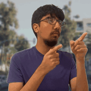 Man in Purple Shirt Pointing