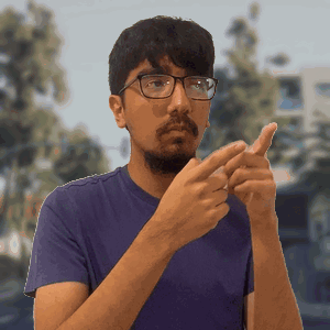 Man in Purple Shirt Pointing