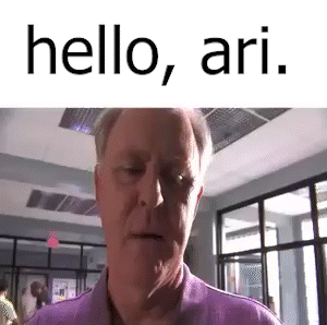 Man in Purple Shirt Saying Hello Ari
