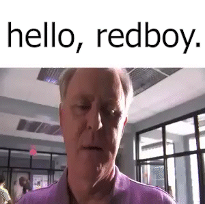 Man in Purple Shirt Says Hello Redboy