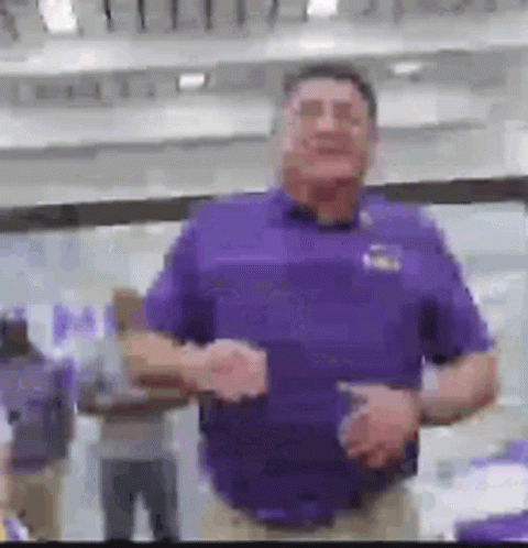 Man in Purple Shirt with Group