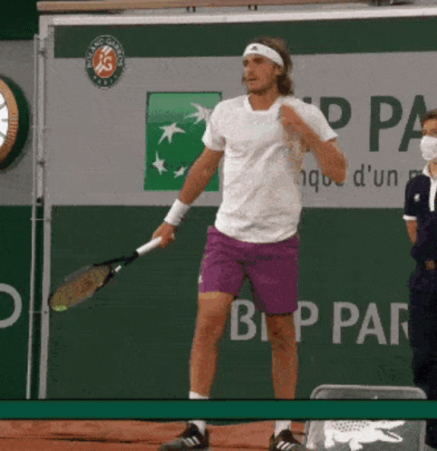 Man in Purple Shorts Holding Tennis Racquet