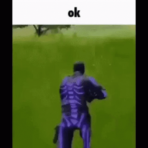 Man In Purple Skeleton Costume Holding Gun GIF