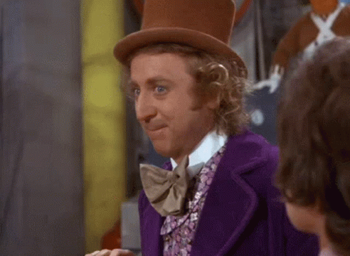 Man in Purple Suit and Top Hat Making Funny Face