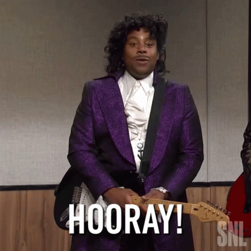 Man in Purple Suit Holding Guitar Hooray