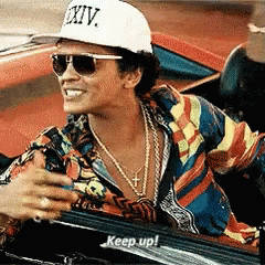 Man In Purple Suit With Disco Ball GIF