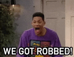 Man in Purple Sweater Saying We Got Robbed