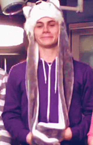 Man in Purple Sweatshirt and White Hat with Ears