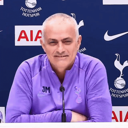 Man in Purple Tottenham Hotspur Jacket at Microphone