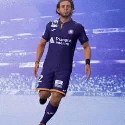 Man in Purple Triangle Jersey