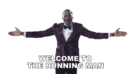 Man in Purple Tuxedo Saying Welcome