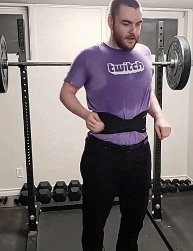 Man in Purple Twitch Shirt Lifting Barbell