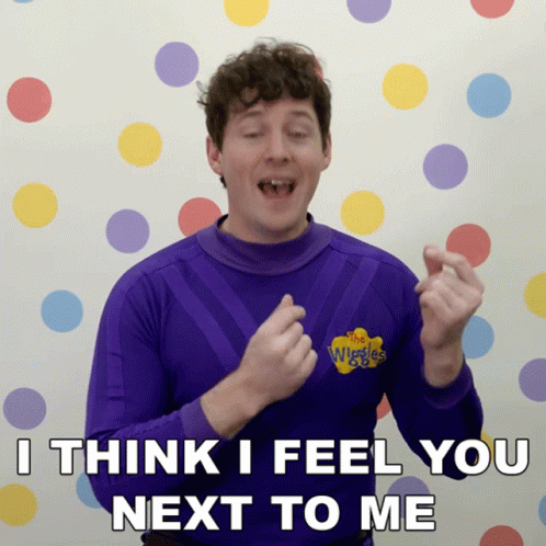 Man In Purple Wiggles Shirt Says I Think I Feel You Next To Me GIF