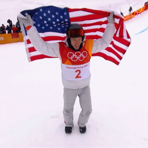 Man in Pyeongchang 2018 Shirt Holding American Flag