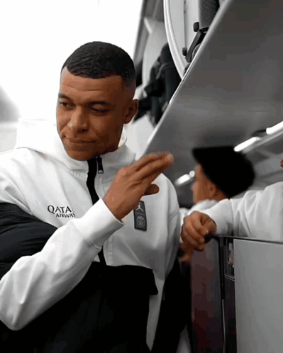 Man In Qata Airways Jacket GIF
