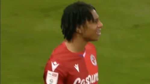 Man in Qatar Air Jersey on Field