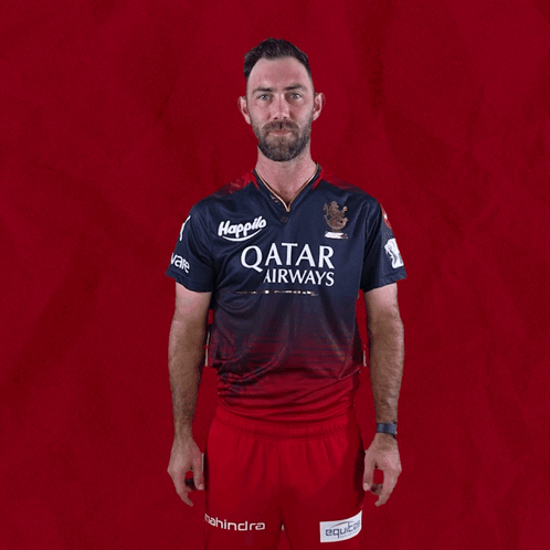 Man in Qatar Airways Shirt Pointing Up