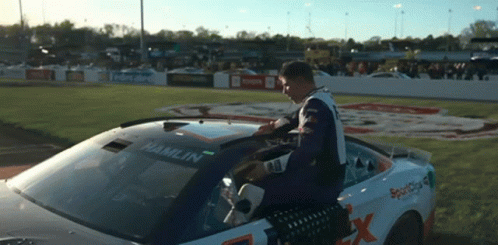 Man in Race Car With Hamlin on Windshield