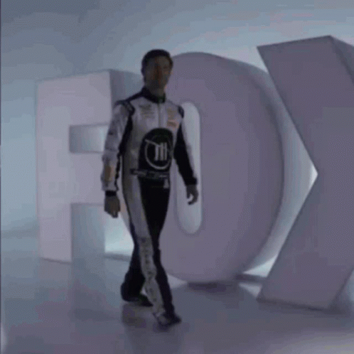 Man in Race Suit and Fox Logo