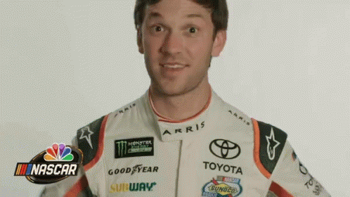 Man in Racing Suit at NBC NASCAR Logo