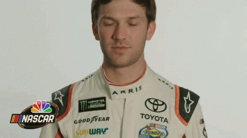 Man in Racing Suit Making Funny Face