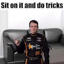 Man in Racing Suit Saying Sit and Do Tricks