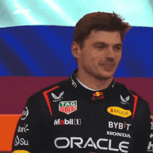 Man In Racing Suit With Oracle GIF