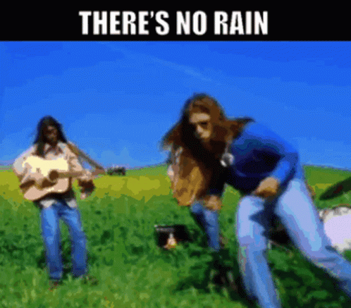 Man in Rain Arms Outstretched Saying Please Stop Raining