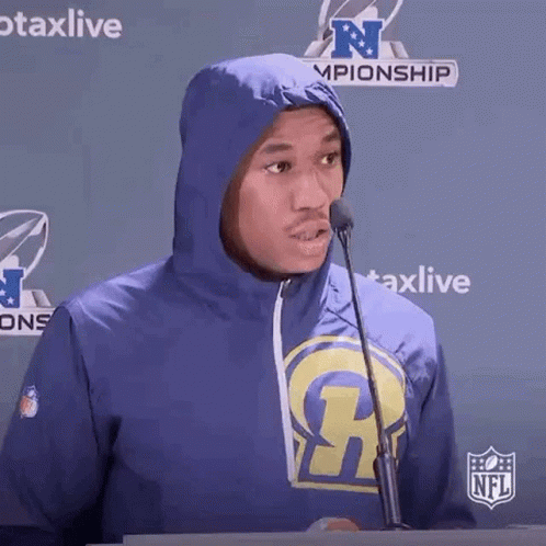Man in Rams Hoodie at Microphone